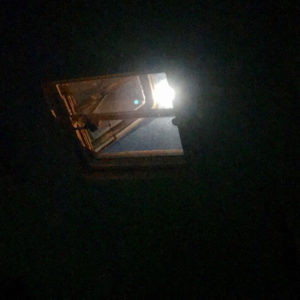 A full moon shines down through my vent at night